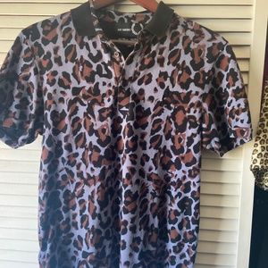 A purple cheetah polo